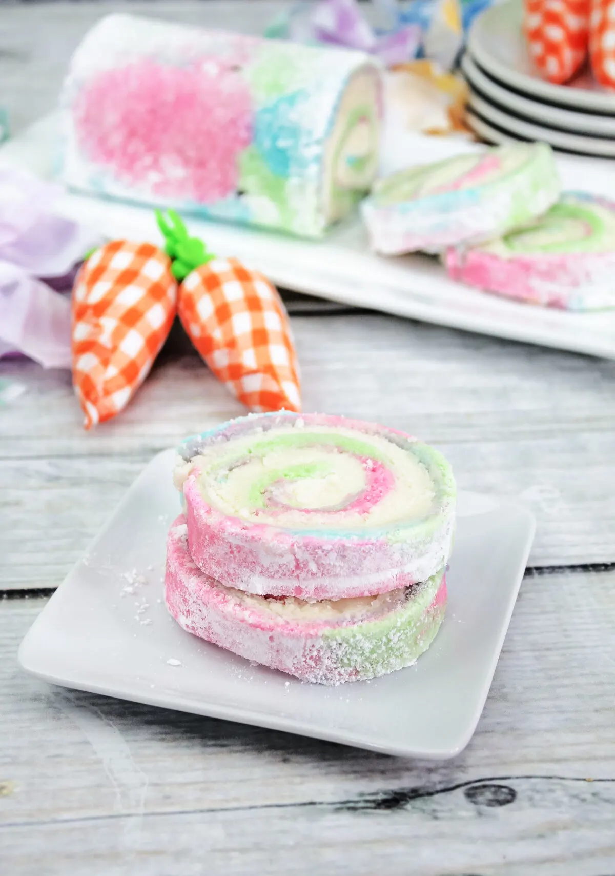 Celebrate Easter with this delicious pastel tie-dyed sponge cake. Learn how to make an impressive, yet easy Easter Swiss Roll recipe here!