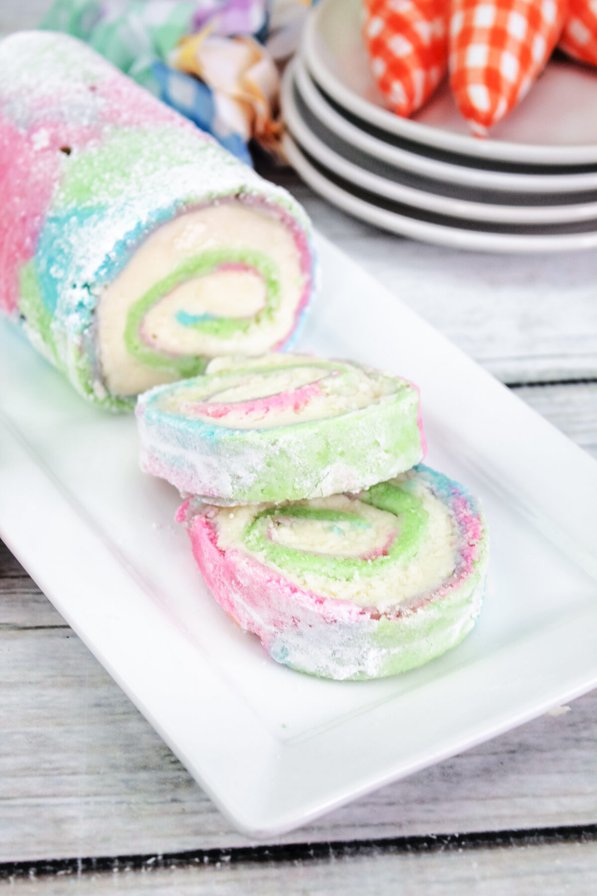 Celebrate Easter with this delicious pastel tie-dyed sponge cake. Learn how to make an impressive, yet easy Easter Swiss Roll recipe here!