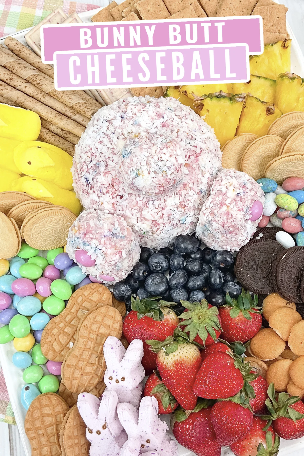 A delicious Bunny Butt Cheese Ball made with strawberry cake mix, cream cheese, sprinkles, and white chocolate – a hit at any Easter party!