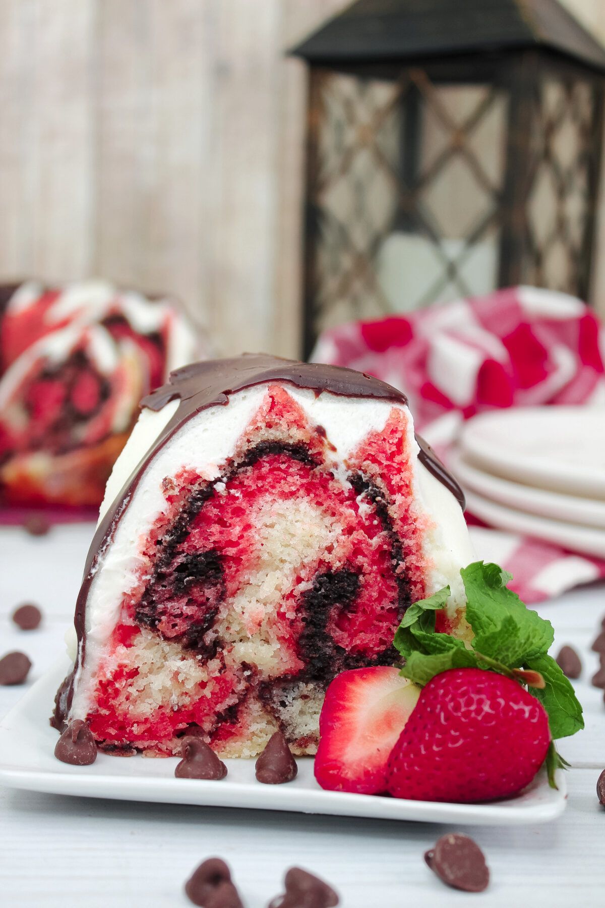 Bake this delicious and easy-to-make Neapolitan Bundt cake with a vanilla glaze, all topped off with chocolate ganache for extra decadence.
