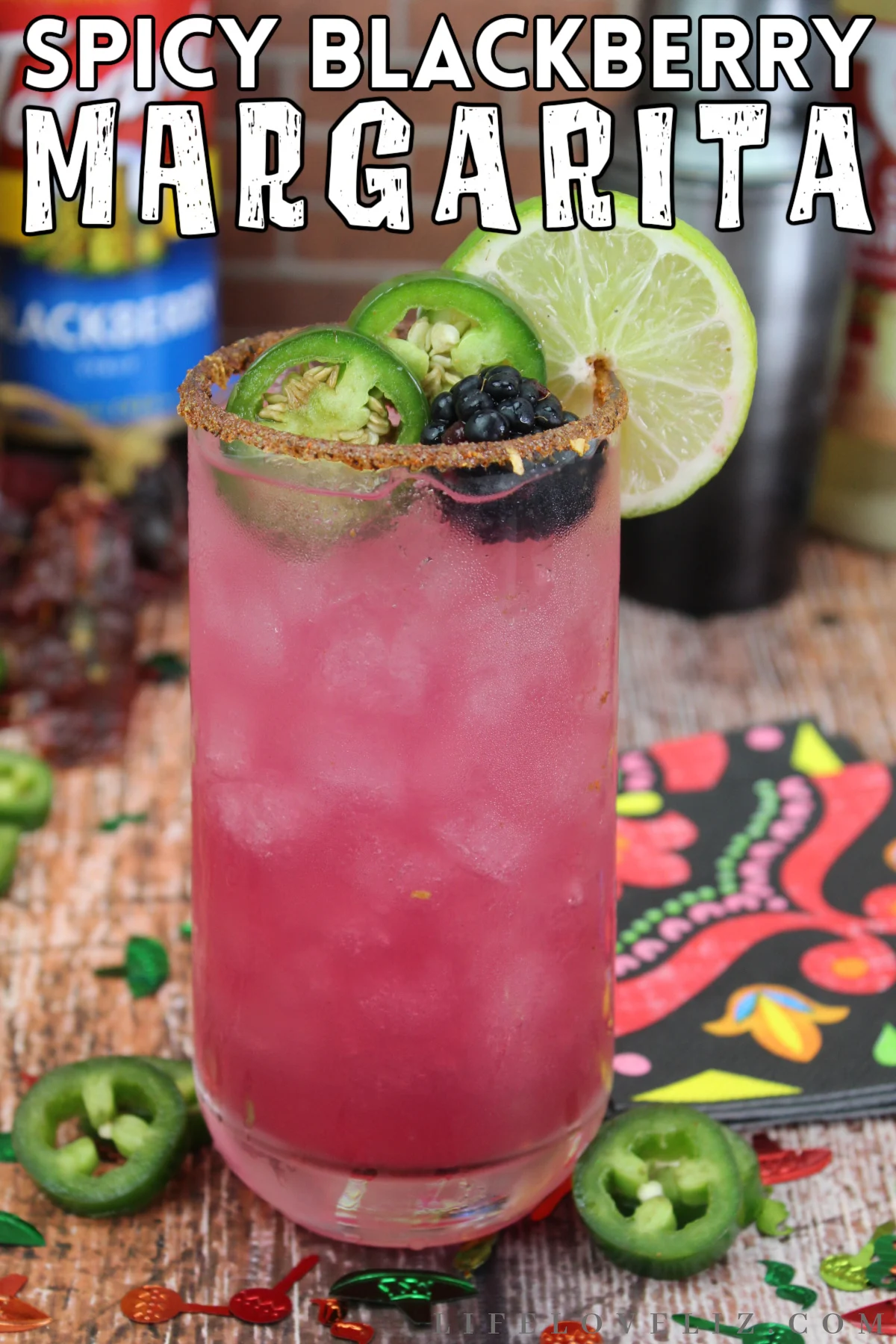 Spice up your summer with this delicious Spicy Blackberry Margarita recipe made with Tajin seasoning, Tequila, blackberry liqueuer, and more.