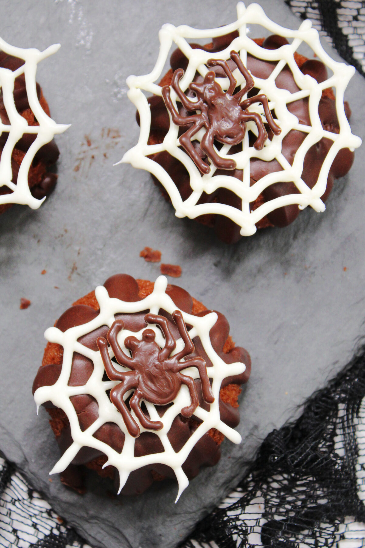 Get creative this Halloween and whip up these spooky, yet delicious mini spider bundt cakes decorated with chocolate spiders and webs.