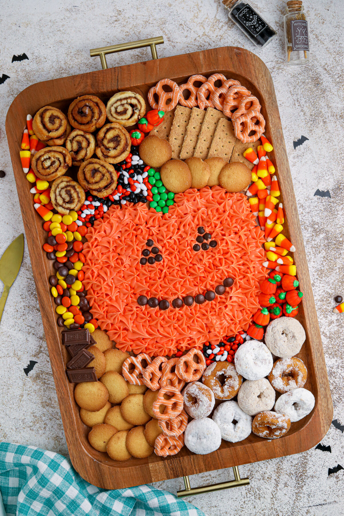 Make your Halloween party one to remember with this easy pumpkin frosting board featuring homemade cream cheese frosting and fun dippers!
