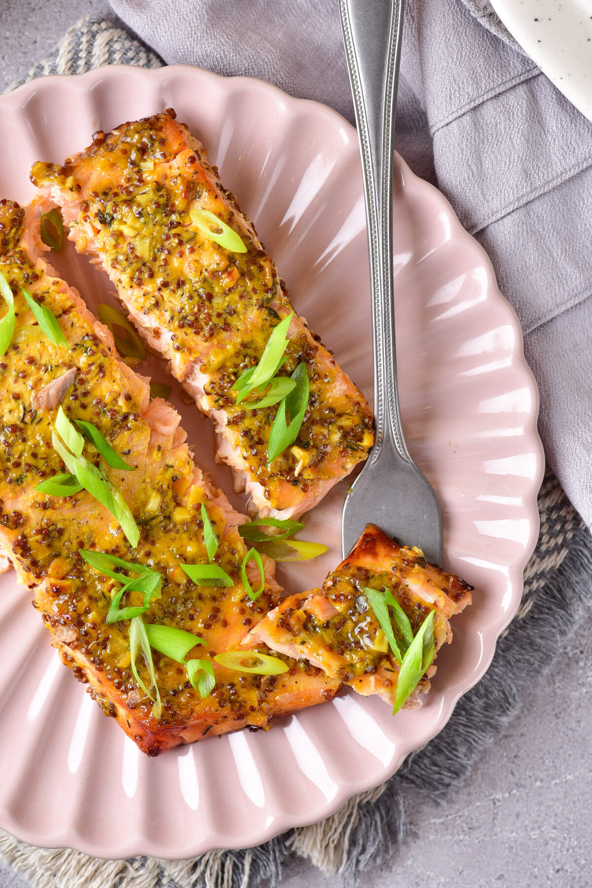 Dive into our Baked Honey Mustard Salmon recipe - a deliciously simple dinner idea! Perfectly seasoned for a mouthwatering meal every time.